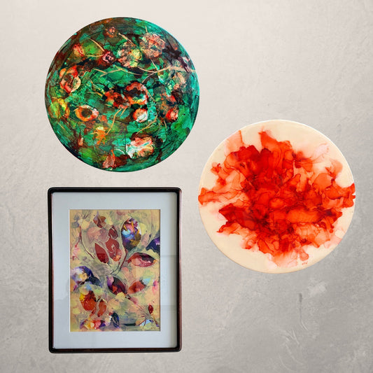 A group of round and rectangular abstracted paintings