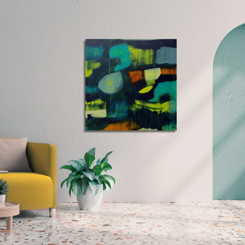 Modern abstract painting on wall in home. Painting colors are navy, turquoise, yellow-green and burnt orange