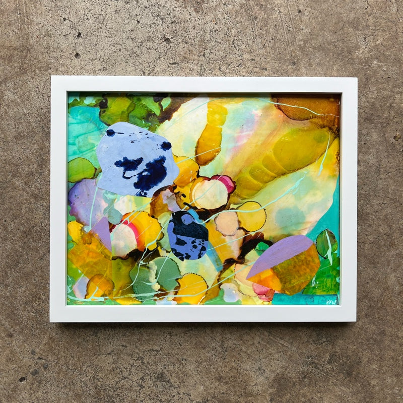 Colorful abstract art with a white frame on a textured background