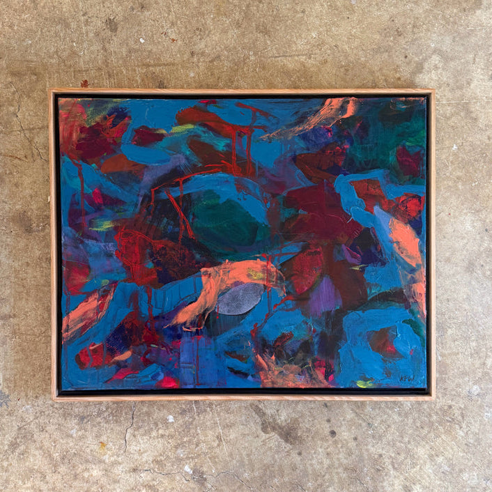 Framed abstract painting with vibrant colors on a textured surface