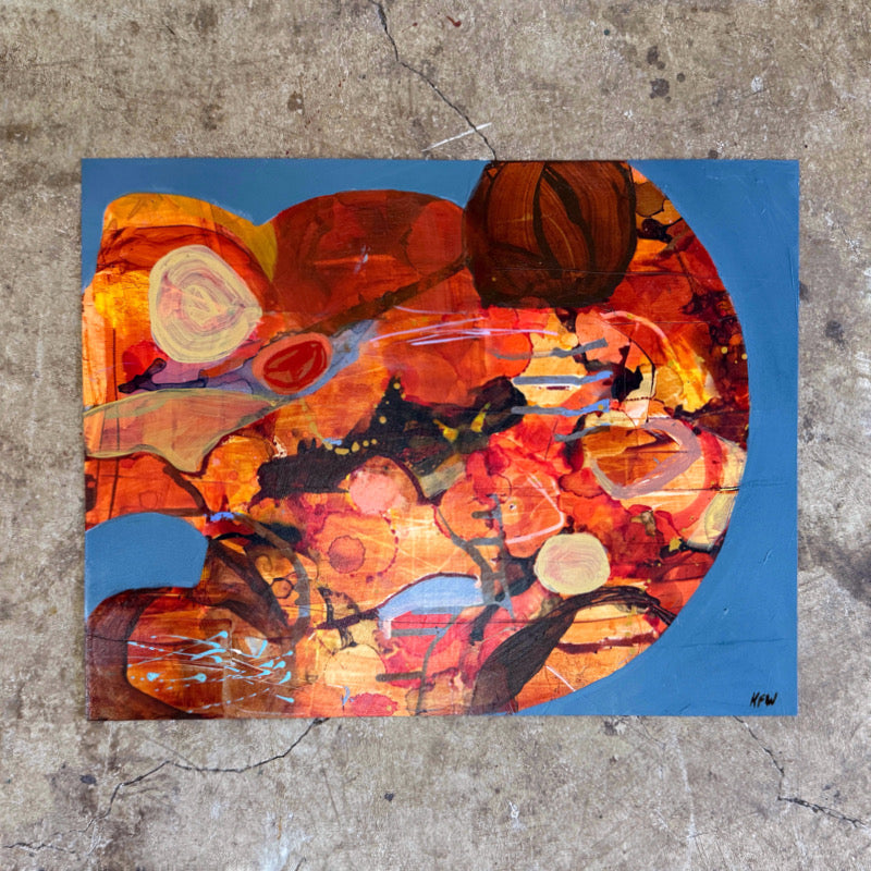 Abstract art piece with warm colors on a textured surface