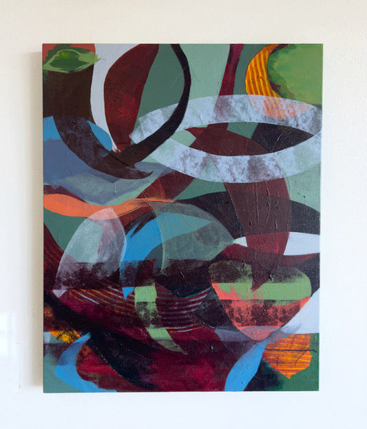 Abstract artwork with colorful shapes on a white wall