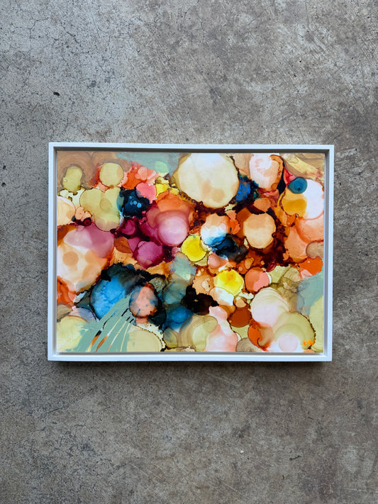 Colorful abstract art piece on a textured surface