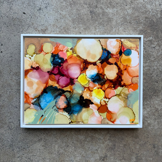 Colorful abstract art piece on a textured surface